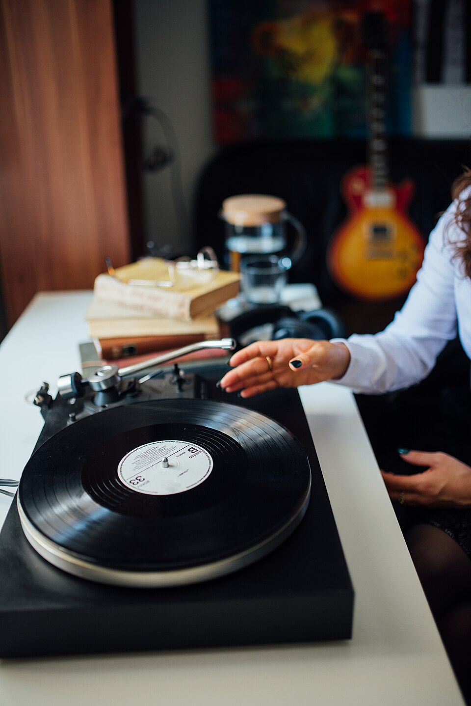 DJ reaching for a vinyl record