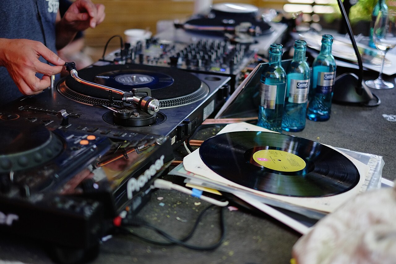 DJ setup with turntables and vinyl records